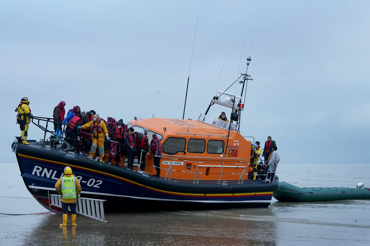 Illegal immigrants are brought in to shore by the RNLI following a small boat incident in the English Channel in Dungeness, Kent, England, on Nov. 20, 2021. (Gareth Fuller/PA Wire)
