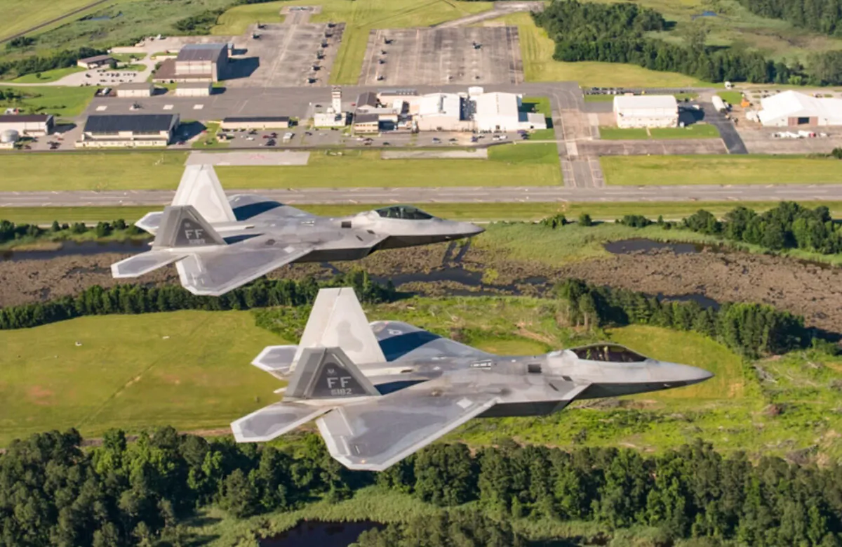 Two U.S. Air Force F-22 Raptors fly over Joint Base Langley-Eustis, on June 14, 2018. (Tech. Sgt. Natasha Stannard/U.S. Air Force)