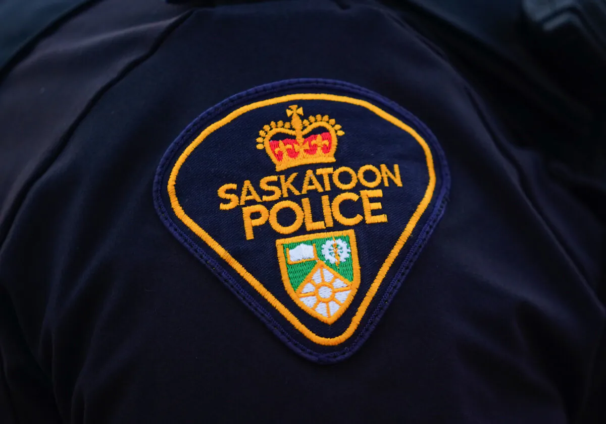 A Saskatoon Police Service badge is shown on an officers' uniform in Saskatoon on May 5, 2023. (The Canadian Press/Heywood Yu)