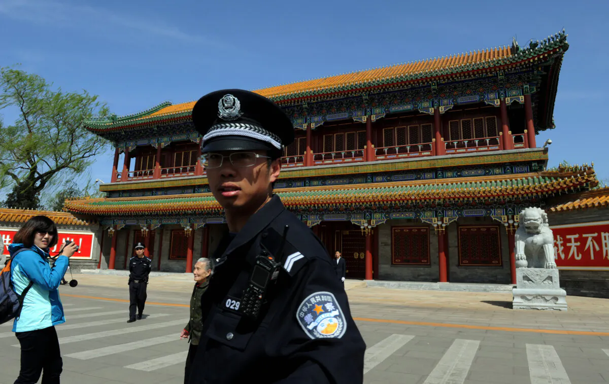 A Chinese policeman stands guard outside Zhongnanhai, which serves as the central headquarters for the Chinese Communist Party, after the sacking of politician Bo Xilai from the country's powerful Politburo, in Beijing on April 11, 2012. (Mark Ralston/AFP via Getty Images)