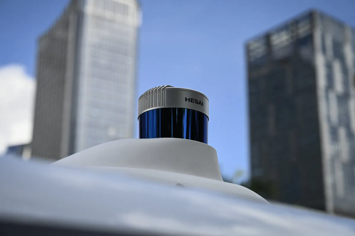 A lidar sensor on top of an  autonomous vehicle developed by Baidu Apollo as it drives along a street in Shenzhen, Guangdong Province, China, on July 10, 2022. (Jade Gao/AFP via Getty Images)