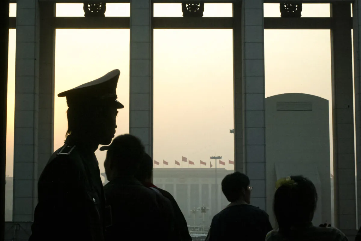 A Chinese guard stand at his post at the National Museum in Beijing. A U.S. intelligence report last year revealed that the CCP is more willing to interfere in U.S. elections now than in previous cycles. (Frederic J. Brown/AFP via Getty Images)