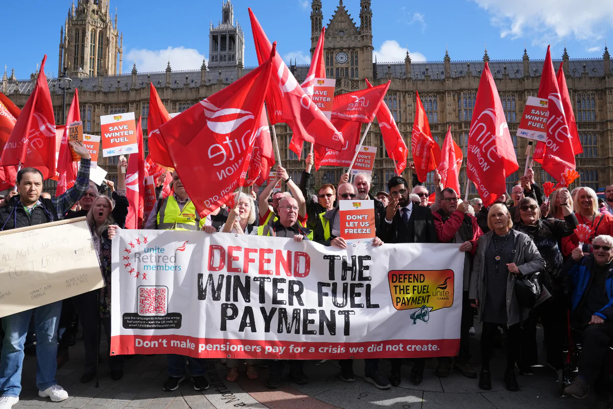 Campaigners take part in a protest against the government's decision to scrap the winter fuel allowance for pensioners, outside the Houses of Parliament in Westminster, London, on Oct. 7, 2024. (Lucy North/PA Wire)