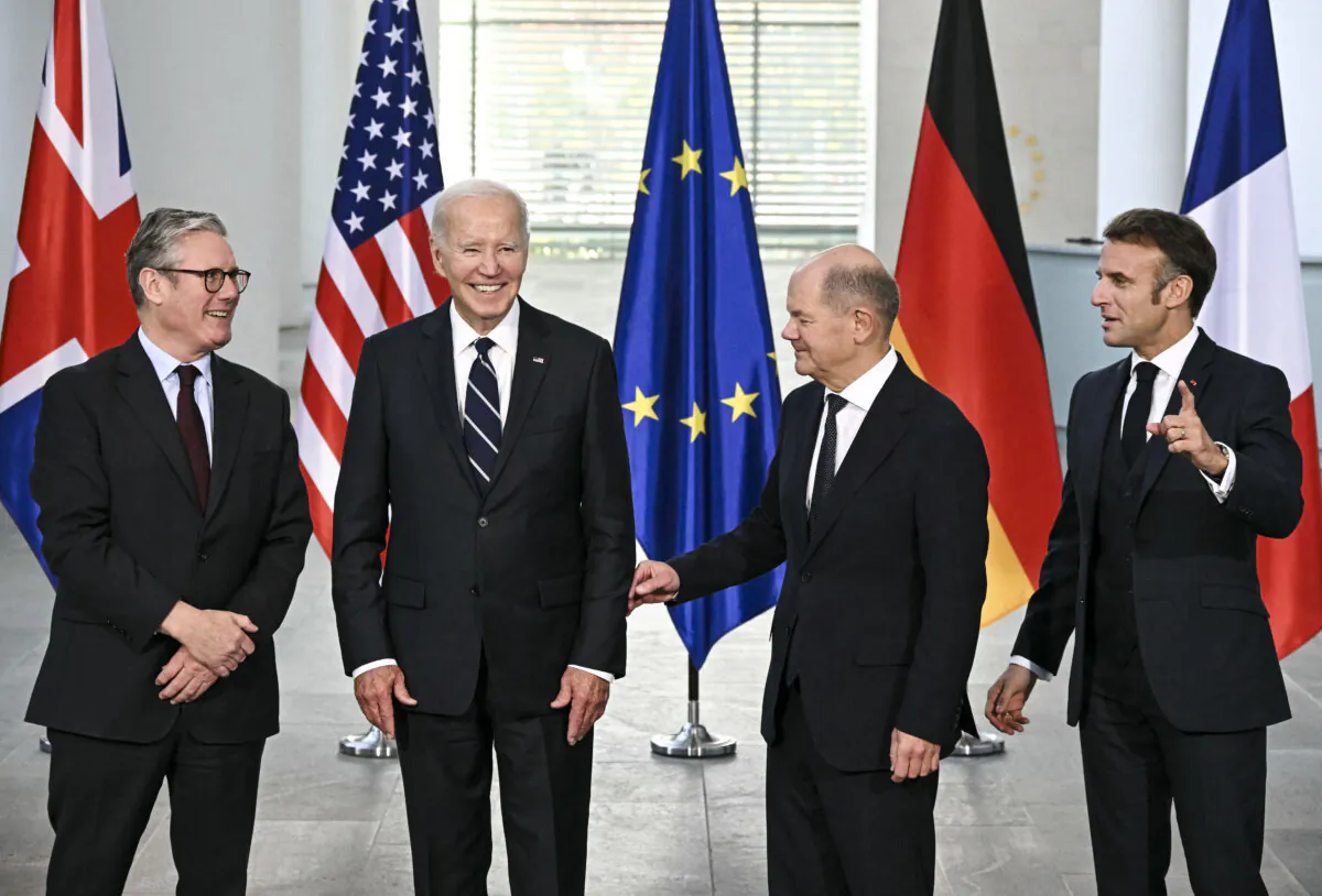 (L-R) British Prime Minister Keir Starmer, U.S. President Joe Biden, German Chancellor Olaf Scholz, and French President Emmanuel Macron pose for a photo at the start of their "Quad meeting" at the Chancellery in Berlin, on Oct. 18, 2024. (Tobias Schwarz/AFP via Getty Images)
