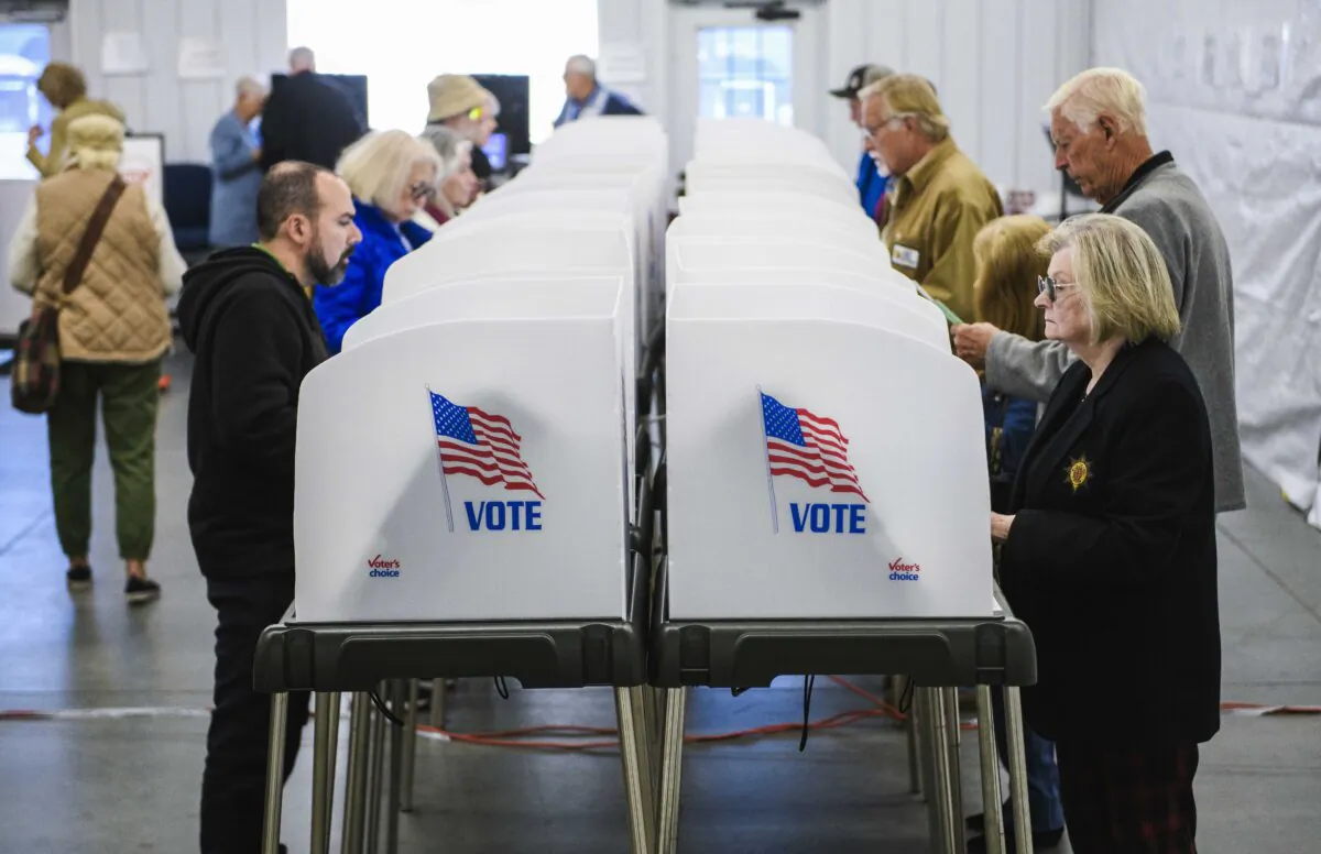 Voters make selections at their voting booths inside an early voting site in Hendersonville, N. C., on Oct. 17, 2024. (Melissa Sue Gerrits/Getty Images)