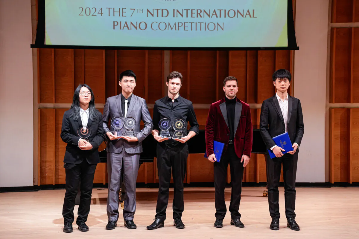Award winners of NTD's Seventh International Piano Competition pose for a photo on the stage of Merkin Hall at the Kaufman Music Center in New York City on Oct. 19, 2024. (Larry Dye/The Epoch Times)