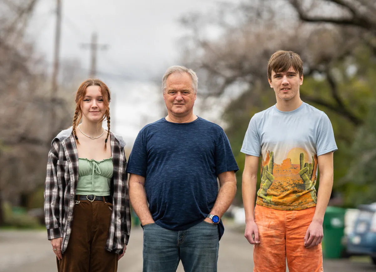 Brett Boman and his children stand at a street near their home in Chico, Calif., on March 12, 2023. (John Fredricks/The Epoch Times)