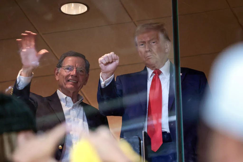 Republican presidential nominee, former U.S. President Donald Trump, joined by U.S. Sen. John Barrasso, R-Wyo., attends the Pittsburgh Steelers game against the New York Jets at Acrisure Stadium in Pittsburgh, on Oct. 20, 2024. (Win McNamee/Getty Images)