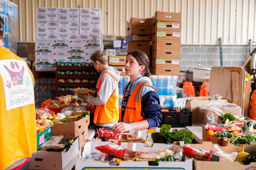 Volunteers prepare food hampers for flood-affected residents at the Hawkesbury’s Helping Hands community organisation in the suburb of South Windsor in Sydney, Australia, on July 6, 2022. (Jenny Evans/Getty Images)