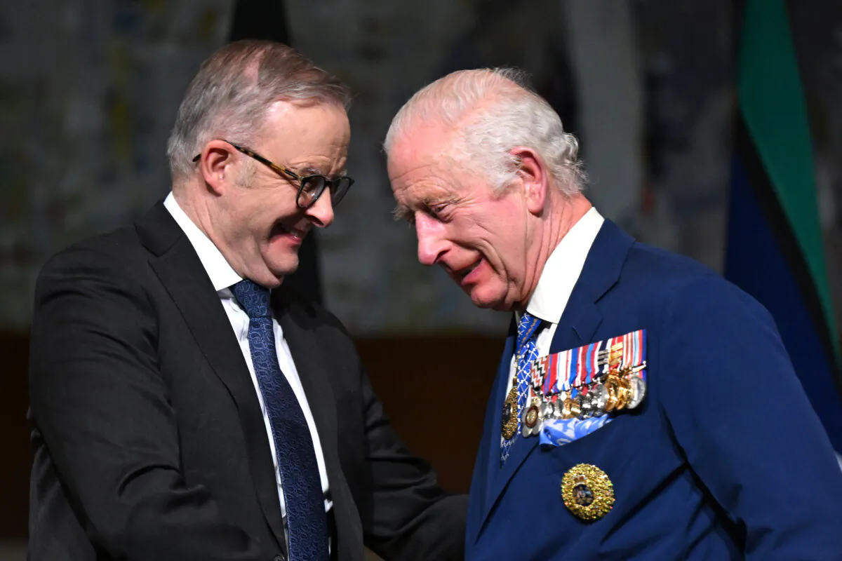 King Charles III (R) shakes hands with Australian Prime Minister Anthony Albanese after attending a reception at Parliament House in Canberra, Australia on Oct. 21, 2024. (Lukas Coch-Pool/Getty Images)