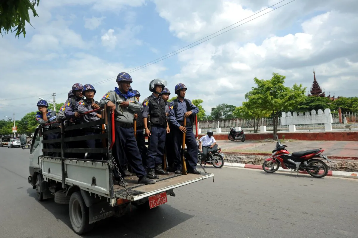 Burmese police force are deployed on the streets of Mandalay in central Burma on July 4, 2014. (Soe Than Win/AFP via Getty Images)