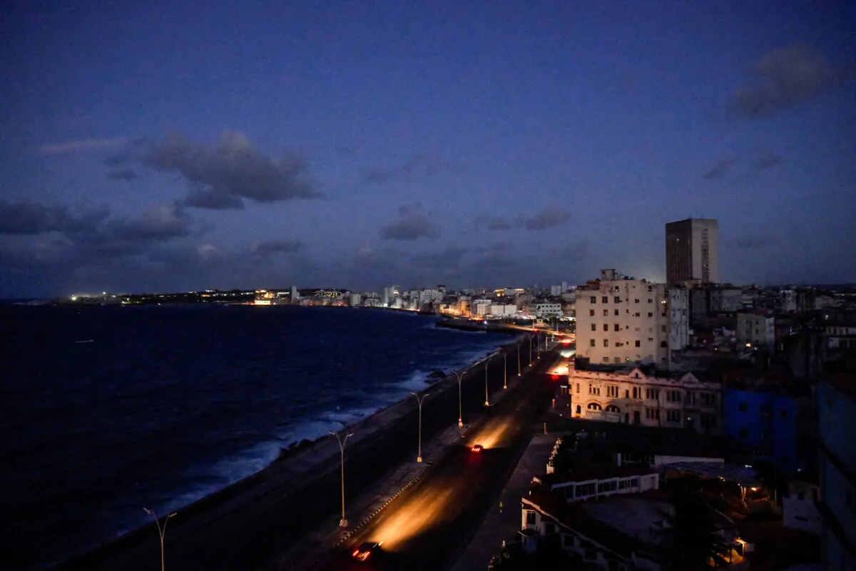 Cars drive on Havana's seafront boulevard Malecon as the country's electrical grid collapsed again on Sunday, in Havana, Cuba, on Oct. 20, 2024. (Norlys Perez/Reuters)