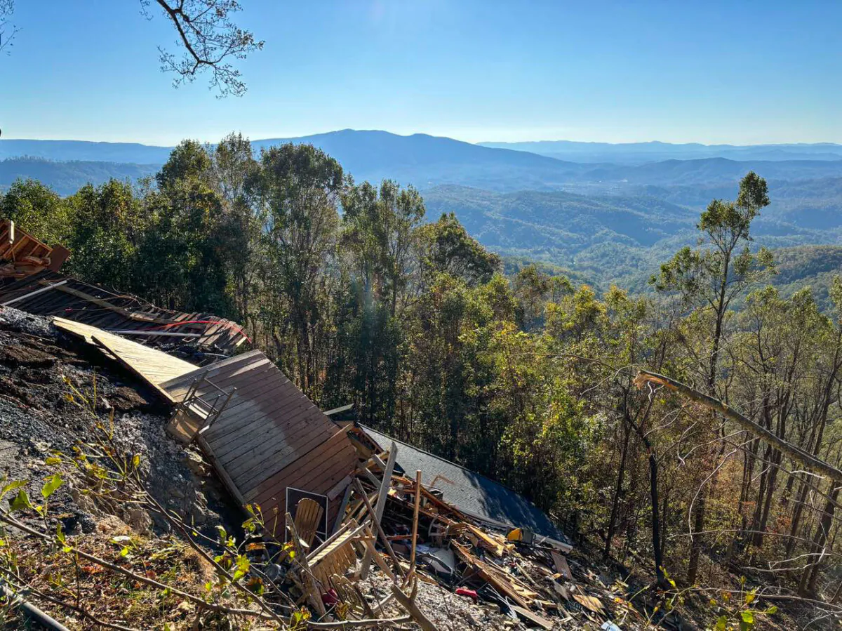 Part of the Alpine Inn, a hotel in Little Switzerland, N.C., collapsed down a mountainside during a mudslide in Hurricane Helene. (Jeff Louderback/The Epoch Times)