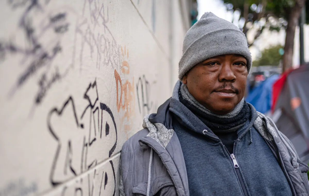 JJ Smith walks down the streets of the Tenderloin District in San Francisco, Calif., on Feb. 23, 2023. (John Fredricks/The Epoch Times)