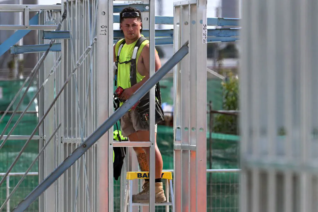 A man works on a construction site building new apartments in Melbourne, Australia on April 4, 2023. (William West/AFP via Getty Images)