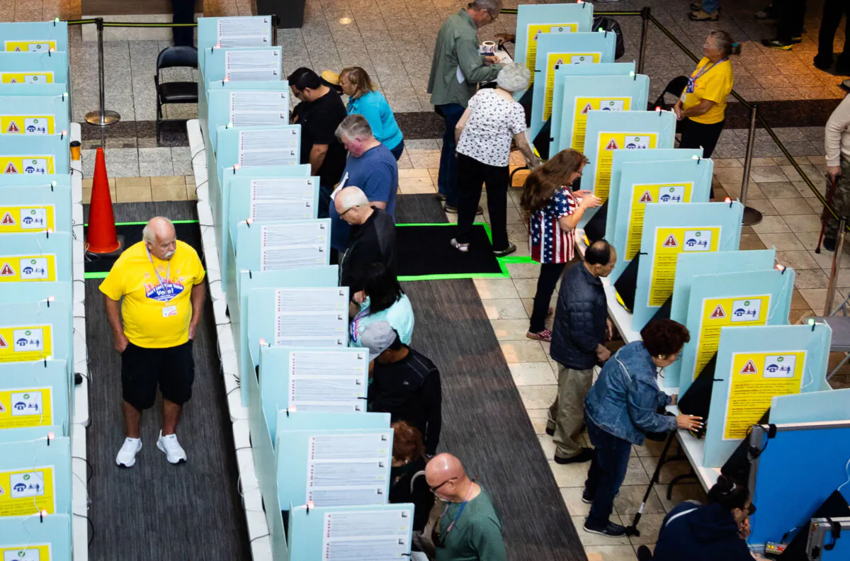 People cast their ballots in a shopping mall in Henderson, Nev., on Oct. 19, 2024. (John Fredricks/The Epoch Times)