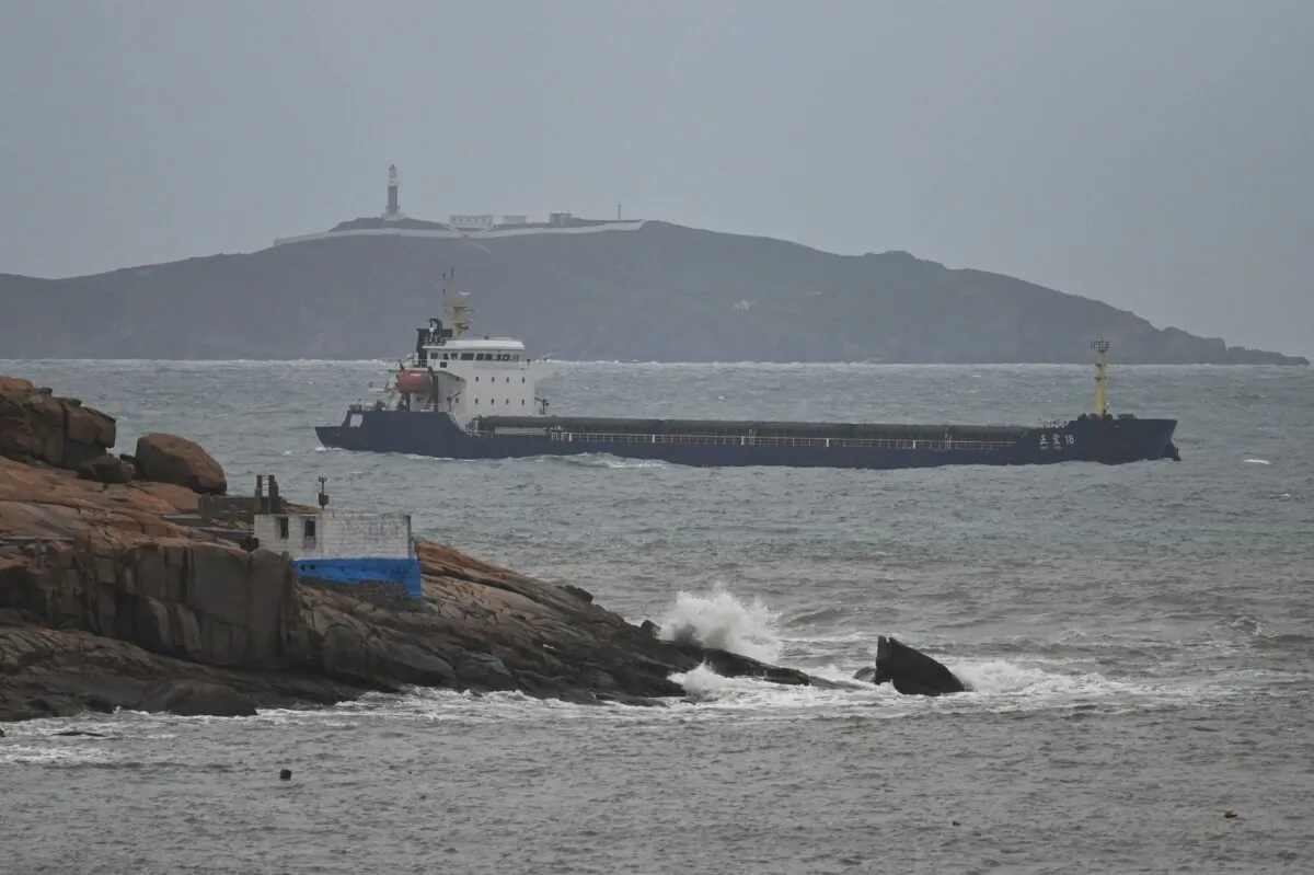 A ship sails in the Taiwan Strait between the coast of Pingtan island (foreground), the closest point to Taiwan, and another island in China's southeast Fujian Province on April 7, 2023. (Greg Baker/AFP via Getty Images)