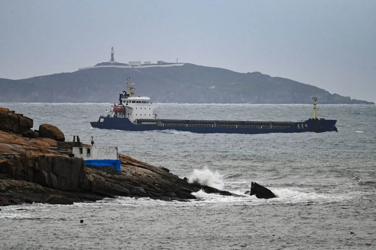 A ship sails in the Taiwan Strait between the coast of Pingtan island (foreground), the closest point to Taiwan, and another island in China's southeast Fujian Province on April 7, 2023. (Greg Baker/AFP via Getty Images)
