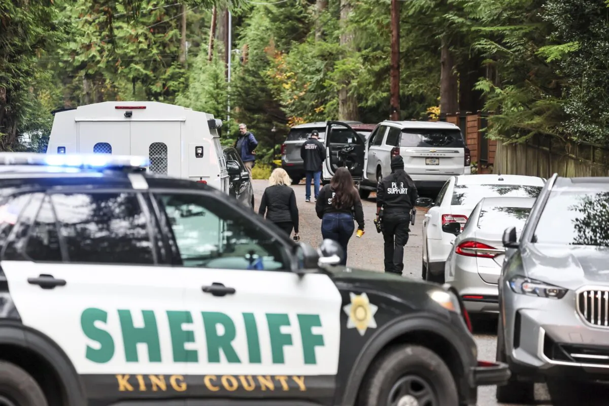 Police arrive on the scene of a shooting in Fall City, Wash., on Oct. 21, 2024. (Kevin Clark/The Seattle Times via AP)