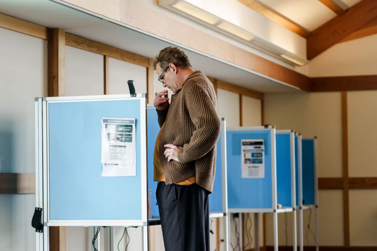 A voter at the Jack London Aquatic Center in Oakland on March 5 during California's primary election. (Philip Pacheco/Getty Images)