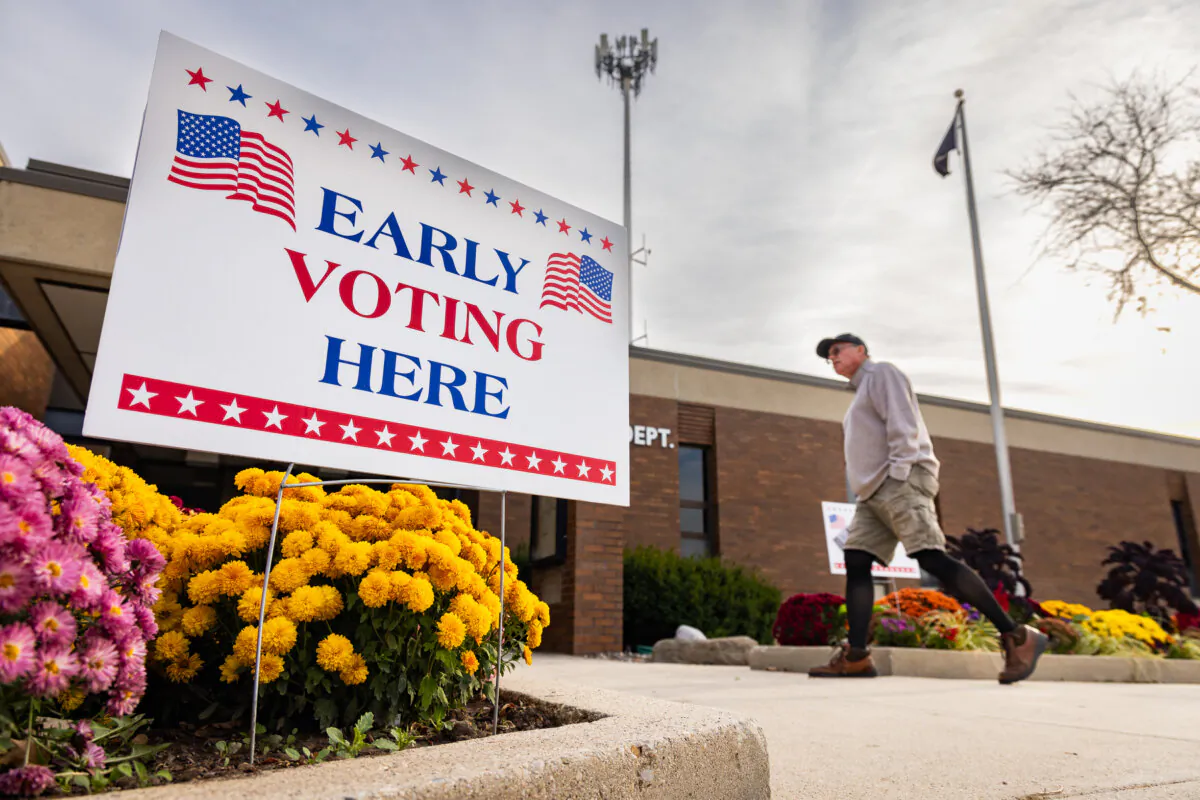 People prepare to early-vote in Brown Deer, Wis., on Oct. 22, 2024. (John Fredricks/The Epoch Times)