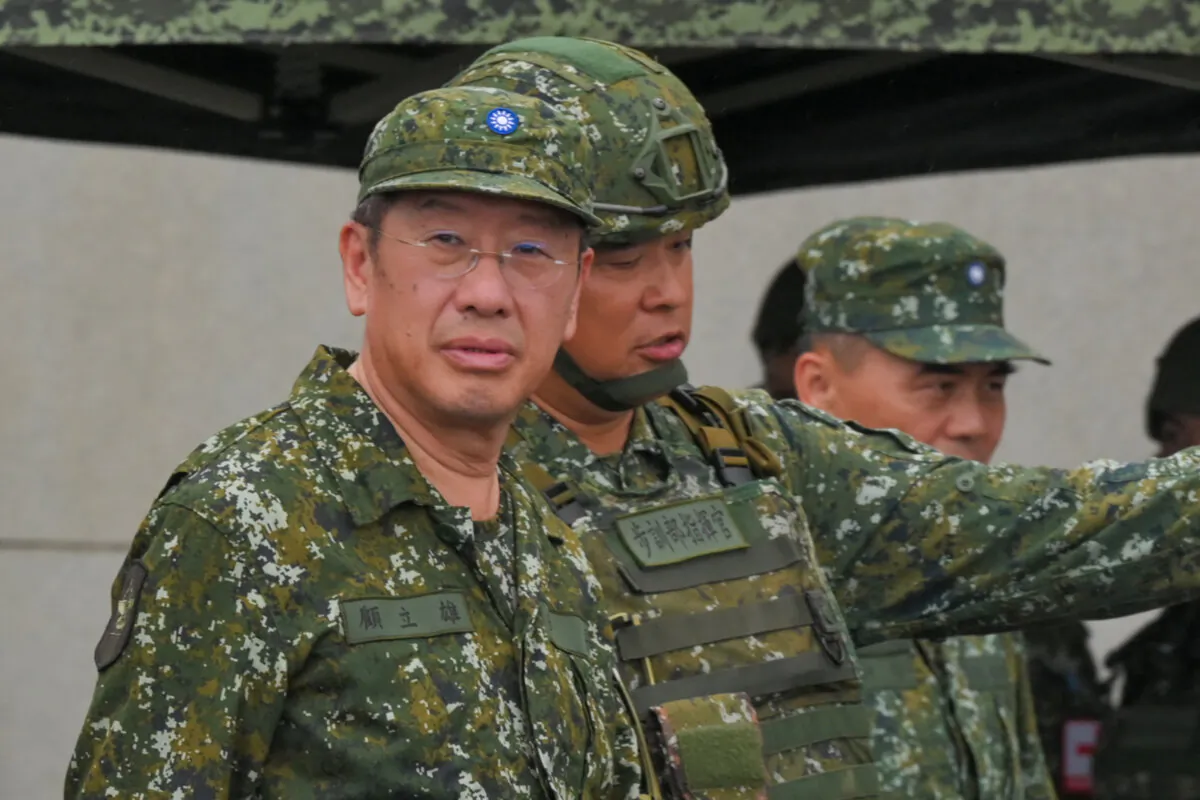 Taiwanese Defense Minister Wellington Koo (L) inspects troops during a live fire exercise at the Fanshan training grounds in Pingtung county of Taiwan on Aug. 26, 2024. (Sam Yeh/AFP via Getty Images)