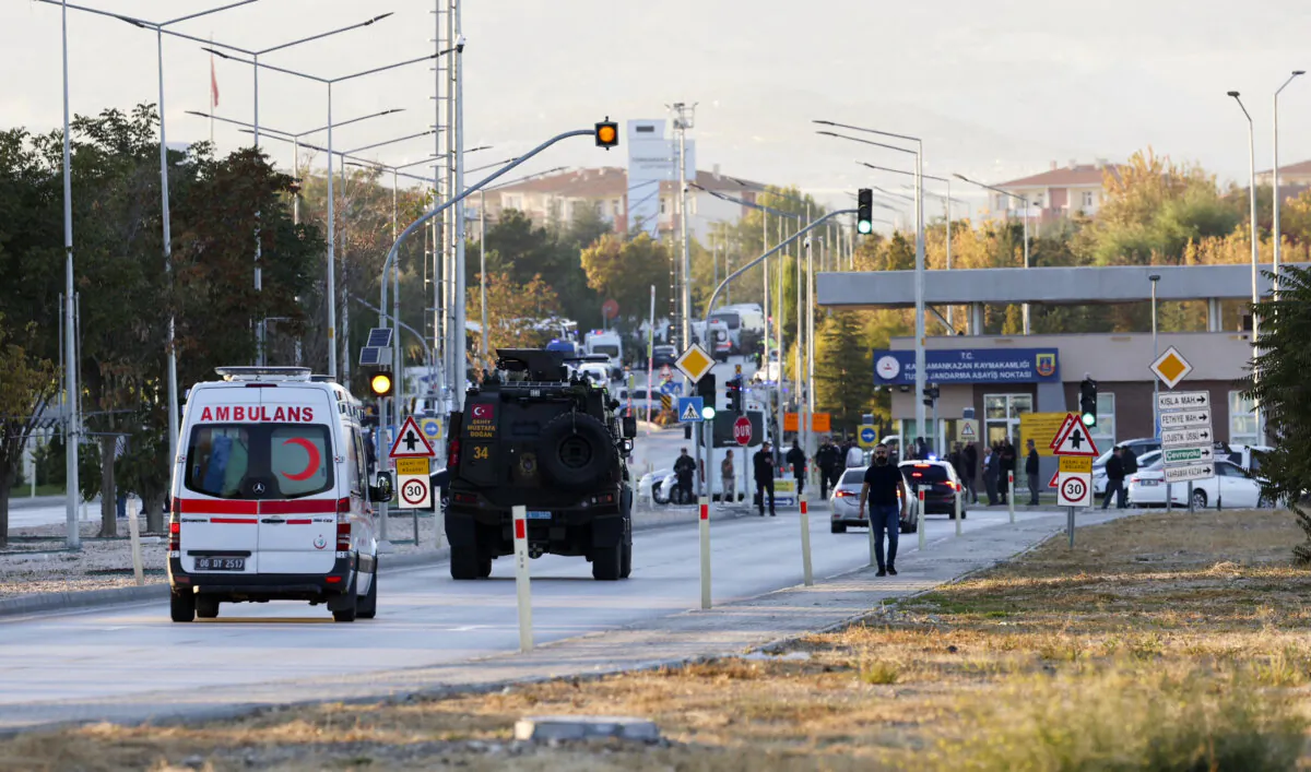 An armored personnel vehicle and an ambulance move along a road in Kahramankazan, about 25 miles north of Ankara, Turkey, on Oct. 23, 2024. (Adem Altan/AFP via Getty Images)