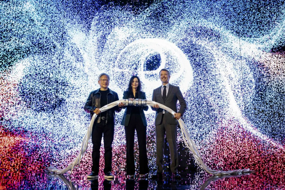 King Frederik X of Denmark (R), CEO and founder of Nvidia Jensen Huang (L), and CEO of the Danish Centre for AI Innovation A/S, Nadia Carlsten (C), symbolically switch on the new AI supercomputer named Gefion at the Vilhelm Lauritzen Terminal in Kastrup, Denmark, on Oct. 23, 2024. (MADS CLAUS RASMUSSEN/Ritzau Scanpix/AFP via Getty Images)