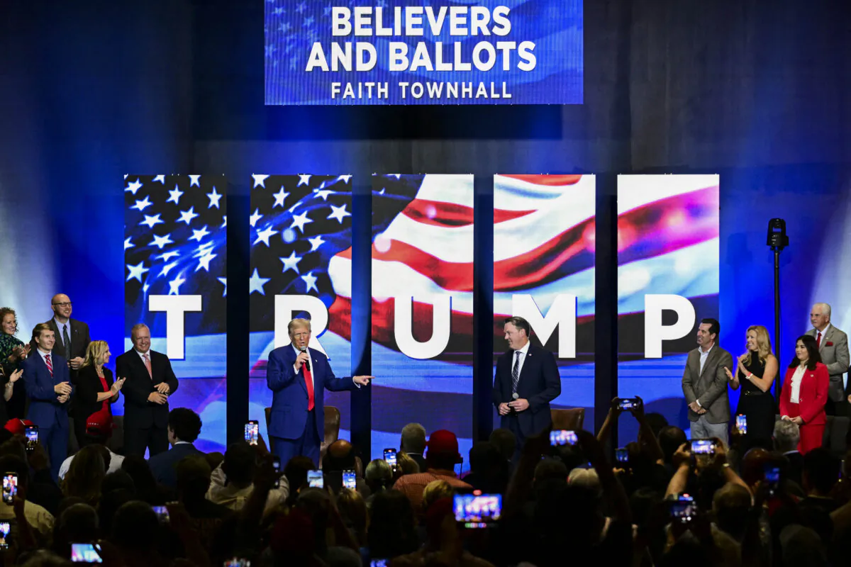 Then-presidential candidate Donald Trump (C-L) speaks during a "Believers and Ballots Faith" town hall with Georgia Lt. Gov. Burt Jones (C-R) in Zebulon, Georgia, on Oct. 23, 2024. (Photo by Jim Watson/AFP via Getty Images)