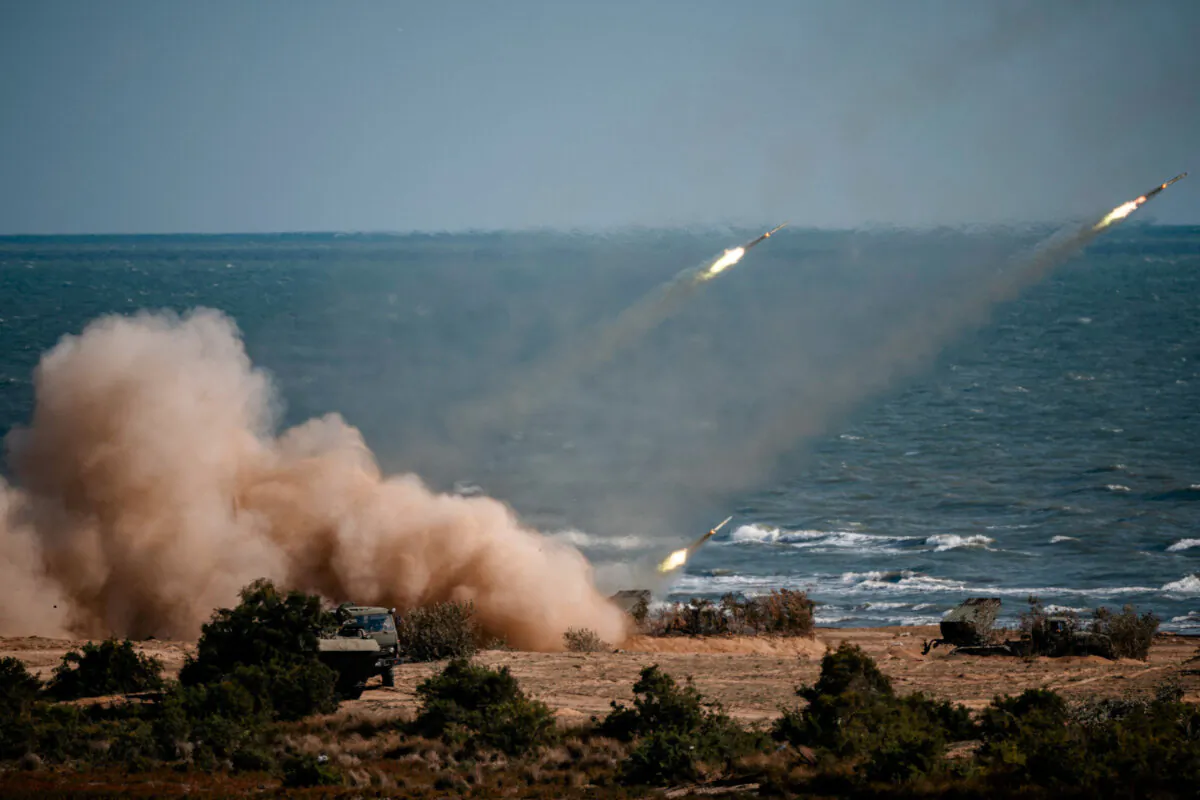 Chinese, Russian, Iranian, Pakistani, and Burmese troops launch rockets from missile systems during the "Caucasus-2020" military drills at the Turali range on the Caspian Sea coast in the Republic of Dagestan in Southern Russia on Sept. 23, 2020. (Dimitar Dilkoff/AFP via Getty Images)