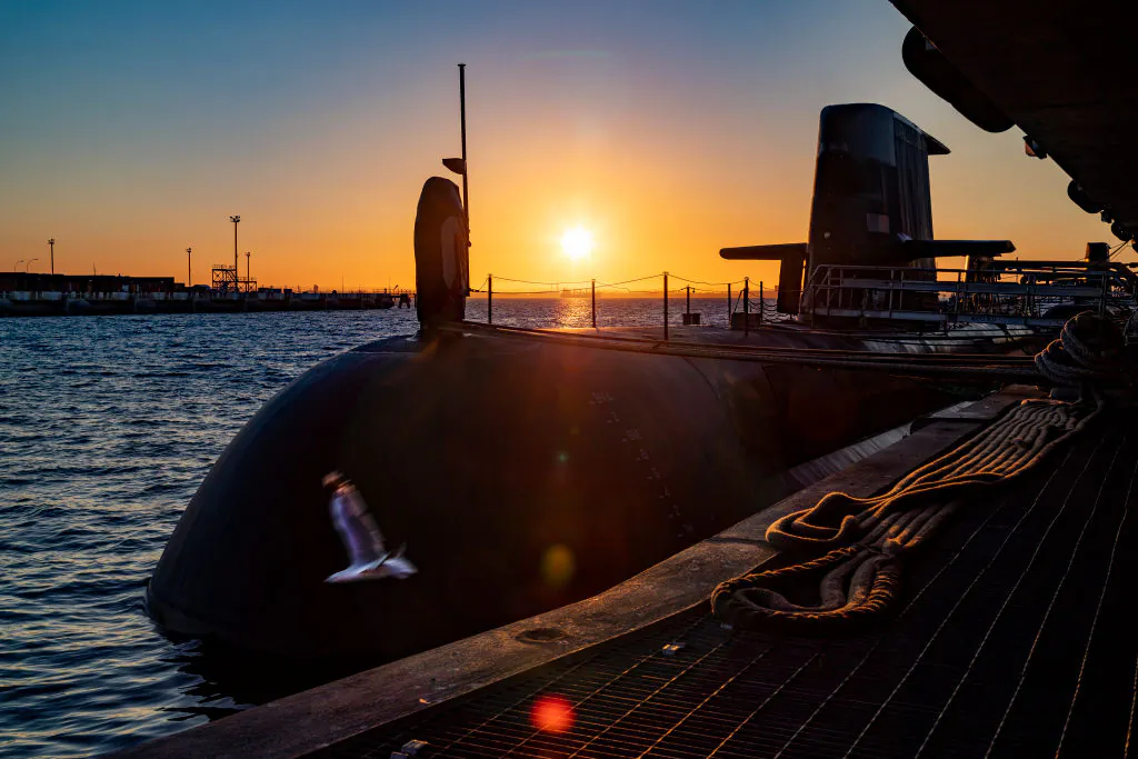 The sun rises over a Royal Australian Navy submarine berthed at HMAS Stirling in Garden Island, Australia, on Jan. 21, 2021. (POIS Yuri Ramsey/Australian Defence Force via Getty Images)