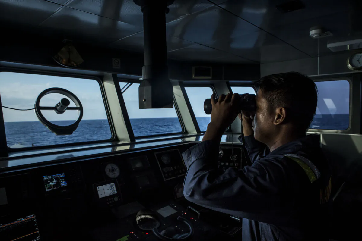A security ship crew of Ministry of Maritime Affairs and Fisheries observes during a patrol in the South China Sea in Natuna, Ranai, Indonesia on Aug. 17, 2016. (Ulet Ifansasti/Getty Images)
