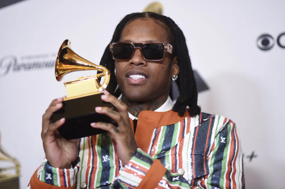 Lil Durk poses in the press room with the award for best melodic rap performance for "All My Life" by Lil Durk featuring J. Cole during the 66th annual Grammy Awards, Feb. 4, 2024, in Los Angeles. (Richard Shotwell/Invision/AP)