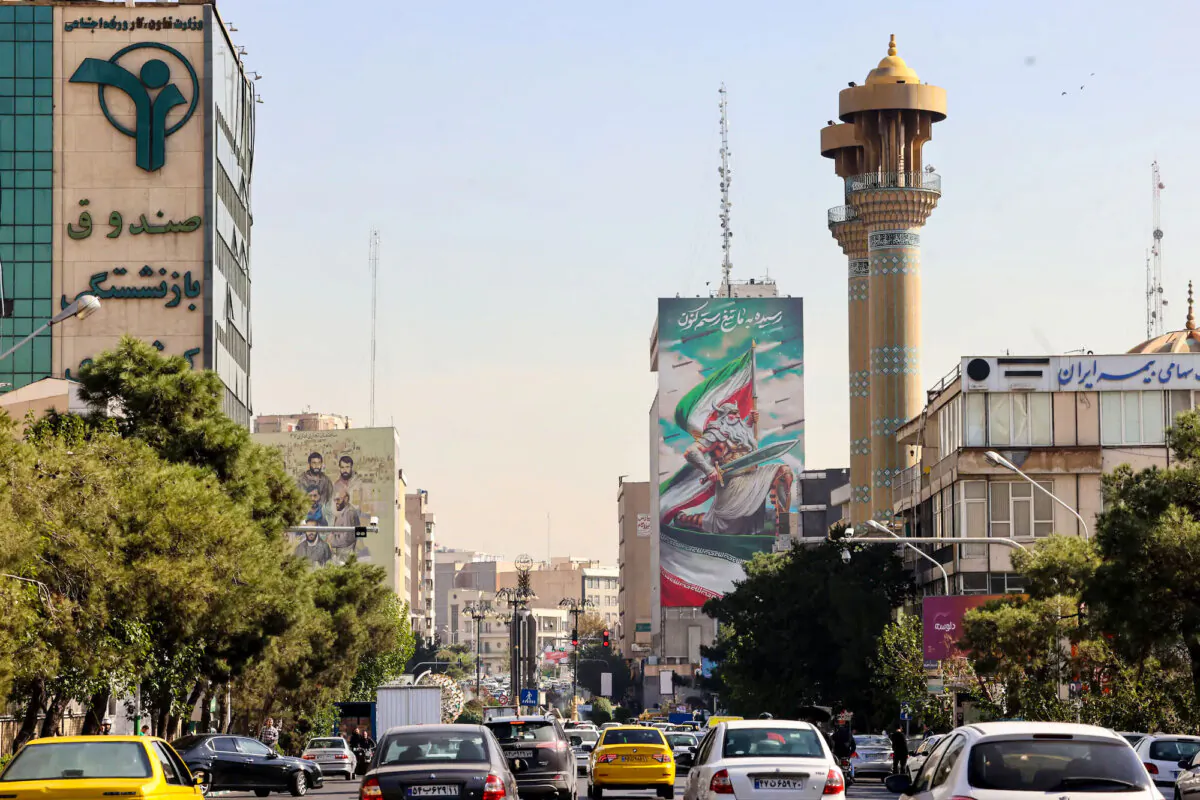 After Israeli strikes triggered blasts that echoed across the city in the night, commuters drive along a street in Tehran, Iran, on Oct. 26, 2024. (Atta Kenare/AFP)