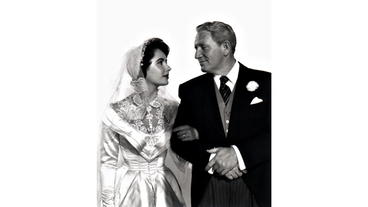 Stanley T. Banks (Spencer Tracy) takes his daughter Kay (Elizabeth Taylor) down the aisle, in “Father of the Bride.” (MovieStillsDB)