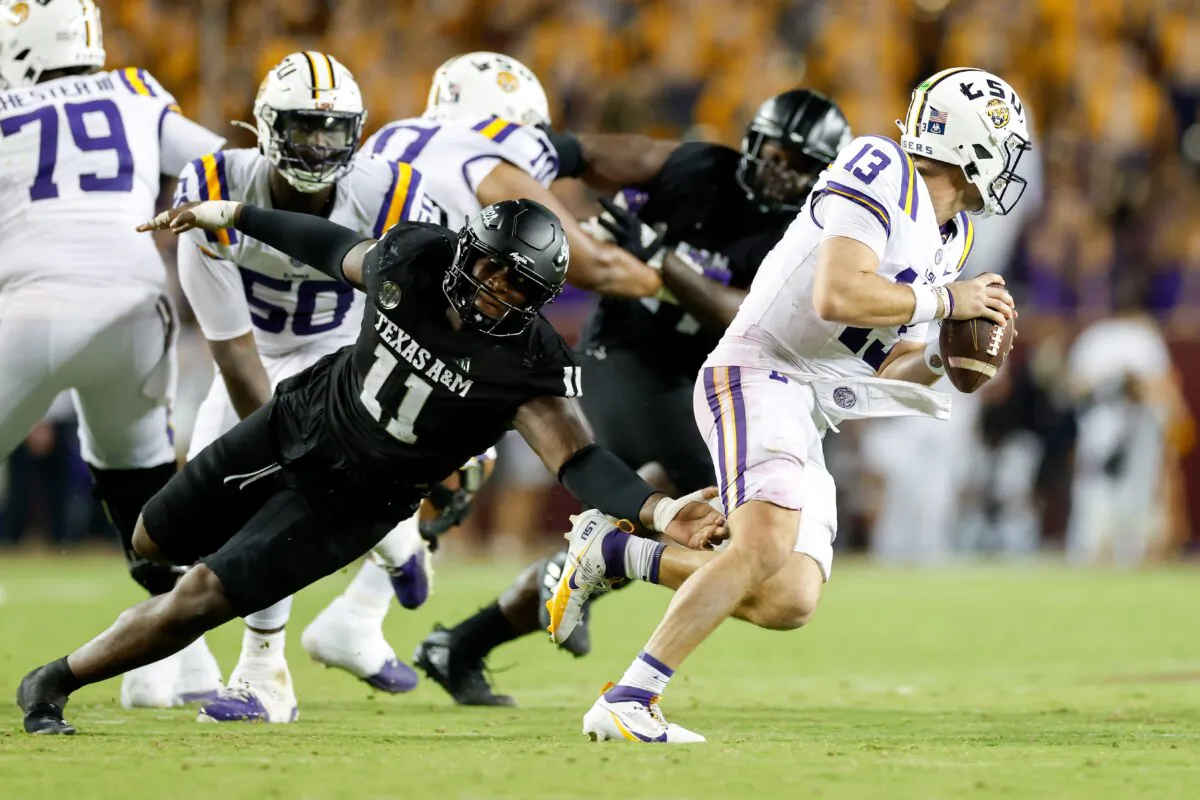 Nic Scourton (11ïŒ of the Texas A&M Aggies pressures Garrett Nussmeier (13) of the LSU Tigers in the second half at Kyle Field in College Station, Texas, on Oct. 26, 2024. (Tim Warner/Getty Images)