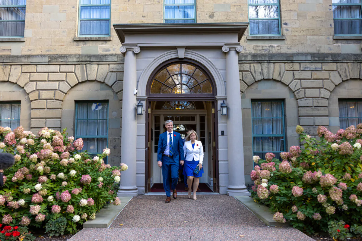 Nova Scotia Premier Tim Houston and his wife Carol leave Government House after meeting with Lt.-Gov. Arthur LeBlanc in Halifax on Oct. 27, 2024. (The Canadian Press/Riley Smith)