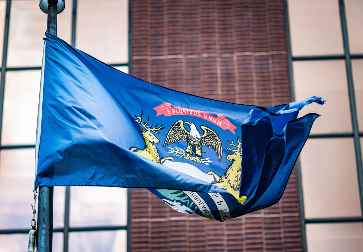 The Michigan state flag waves in Grand Rapids, Mich., on Aug. 28, 2024. (John Fredricks/The Epoch Times)