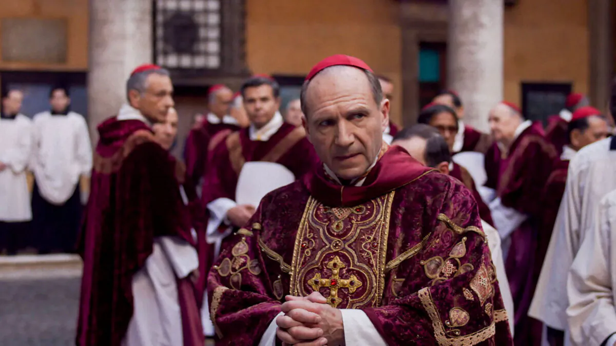 Cardinal Lawrence (Ralph Fiennes, center) is in charge of the proceedings, in "Conclave." (Focus Features)
