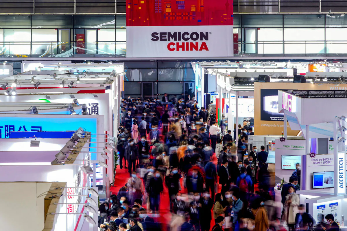 People visit Semicon China, a trade fair for semiconductor technology, in Shanghai on March 17, 2021. (Aly Song/Reuters)