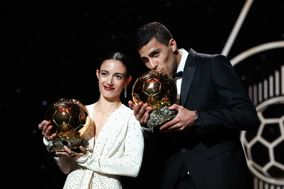Barcelona's Spansih midfielder Aitana Bonmati (L) and Manchester City's Spanish midfielder Rodri pose with their Ballon d'Or award during the 2024 Ballon d'Or France Football award ceremony at the Theatre du Chatelet in Paris on October 28, 2024. (Franck Fife/AFP via Getty Images)