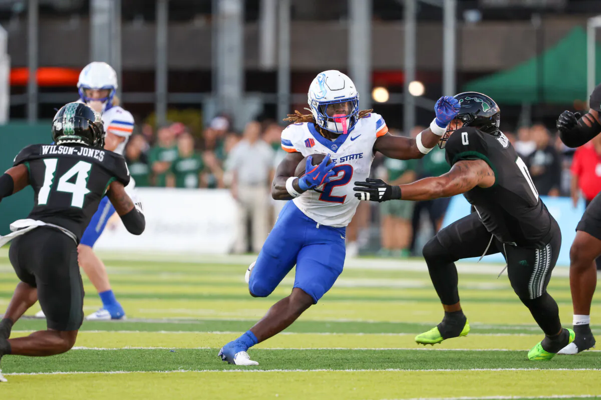 Ashton Jeanty (2) of the Boise State Broncos brushes off Elijah Robinson (0) of the Hawaii Rainbow Warriors during the first half of the game at the Clarence T.C. Ching Athletics Complex in Honolulu on Oct. 12, 2024. (Darryl Oumi/Getty Images)