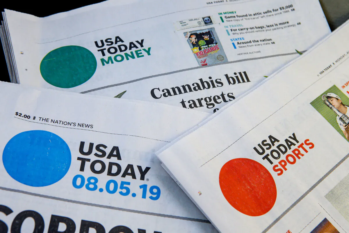 Sections of a USA Today newspaper in Norwood, Mass., on Aug. 5, 2019. (Steven Senne/AP Photo)