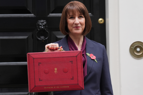 Chancellor of the Exchequer Rachel Reeves poses outside 11 Downing Street with her ministerial red box, before delivering her Budget in the Houses of Parliament in London, England, on Oct. 30, 2024. (Lucy North/PA Wire)