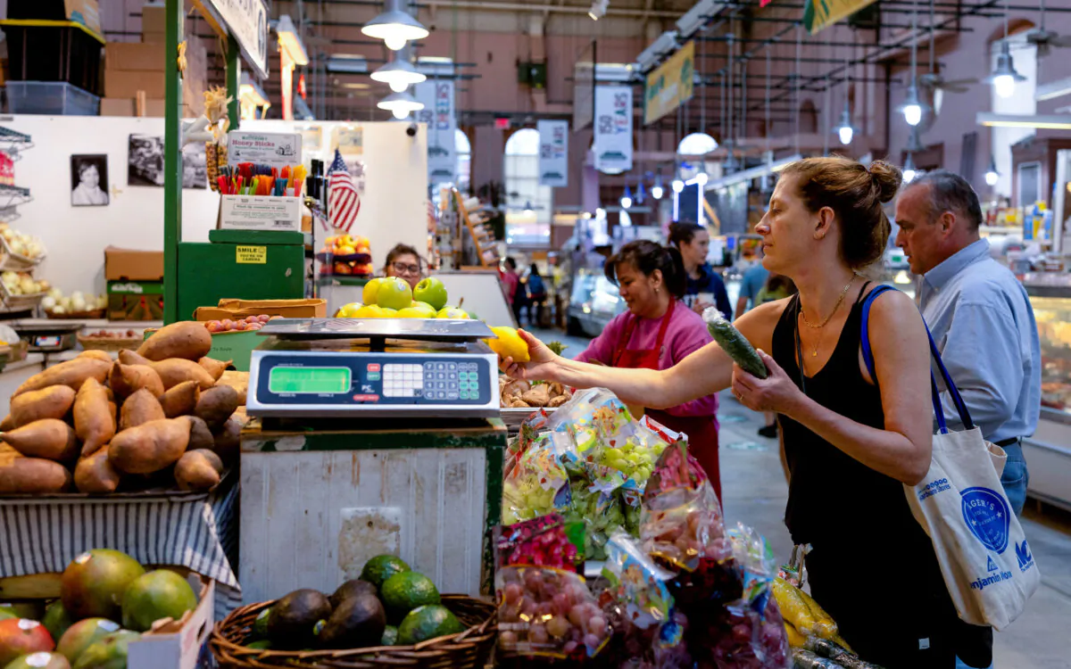 People shop at Eastern Market in Washington on Aug. 9, 2024. (Umit Bektas/Reuters)