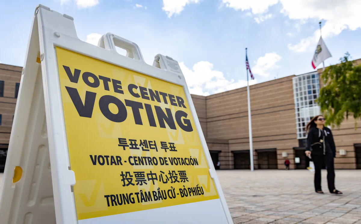 Voters prepare to cast thier ballots in Irvine, Calif., on March 5, 2024. (John Fredricks/The Epoch Times)