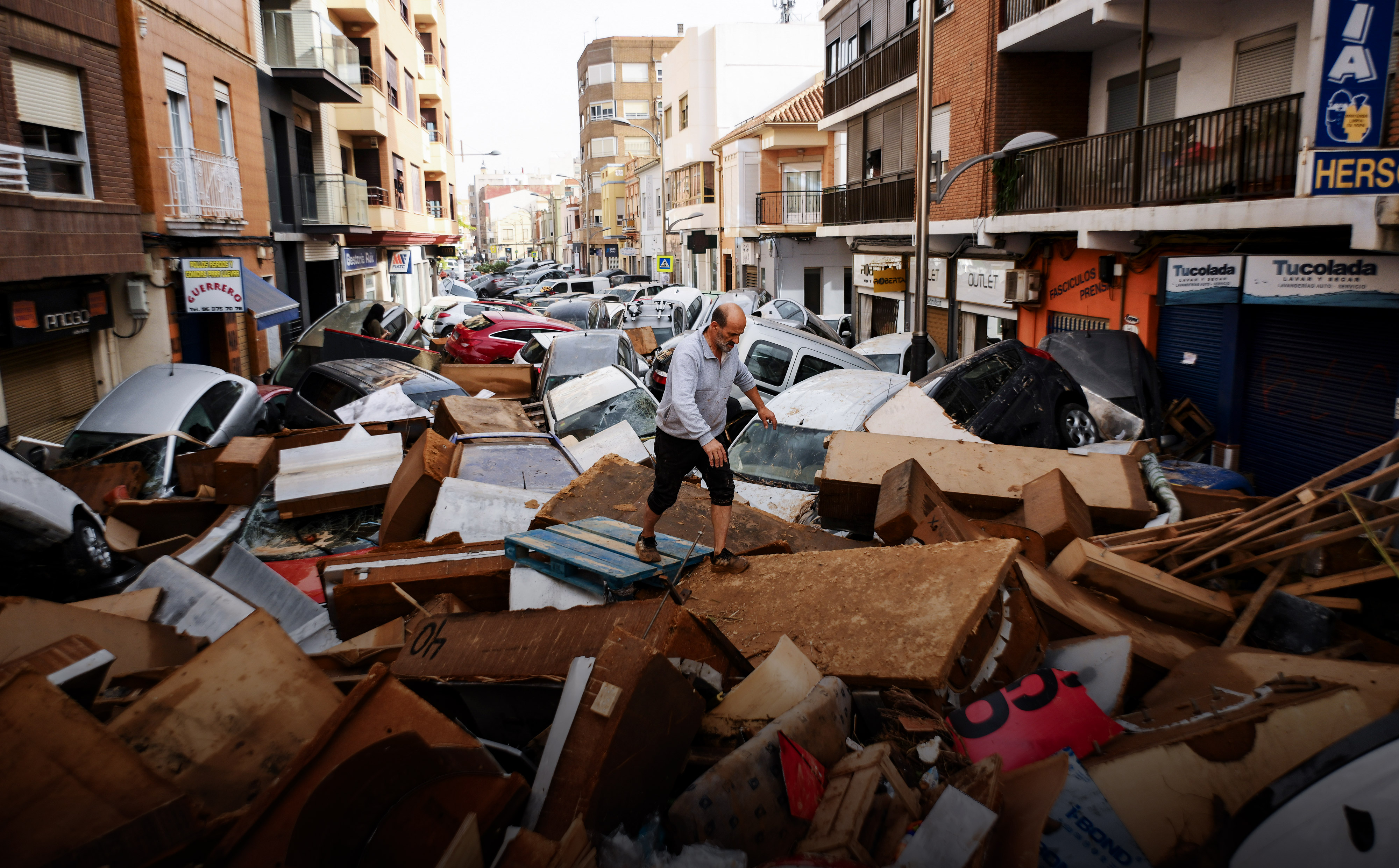 Day in Photos: Severe Flash Floods, Murder Trials, and Honoring Victims of Communism