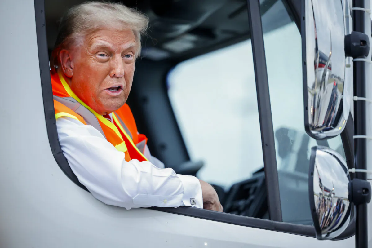 Republican presidential nominee, former President Donald Trump holds a press conference from inside a garbage truck at Green Bay Austin Straubel International Airport in Green Bay, Wis., on Oct. 30, 2024. (Chip Somodevilla/Getty Images)