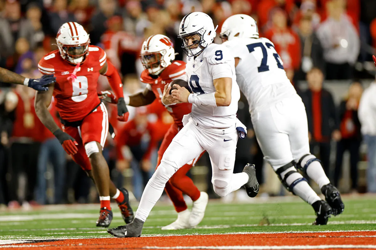 Beau Pribula No. 9 of the Penn State Nittany Lions takes off running in the third quarter against the Wisconsin Badgers at Camp Randall Stadium in Madison, Wis., on Oct. 26, 2024. (John Fisher/Getty Images)