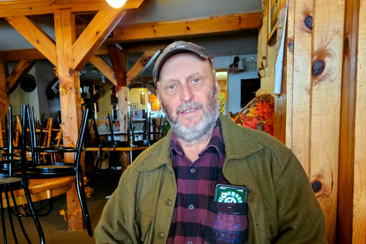 David Arama sits in the restaurant at the Marble Lake Lodge campground he owns in Cloyne, Ont., on Oct. 15, 2024. (Tara MacIsaac/The Epoch Times)